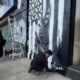 Dase painting a mural in Manhattan. Photo by Sarah Sansom.