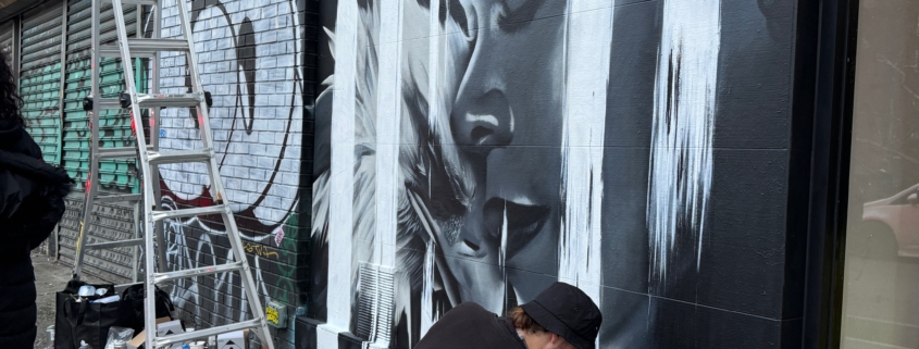 Dase painting a mural in Manhattan. Photo by Sarah Sansom.